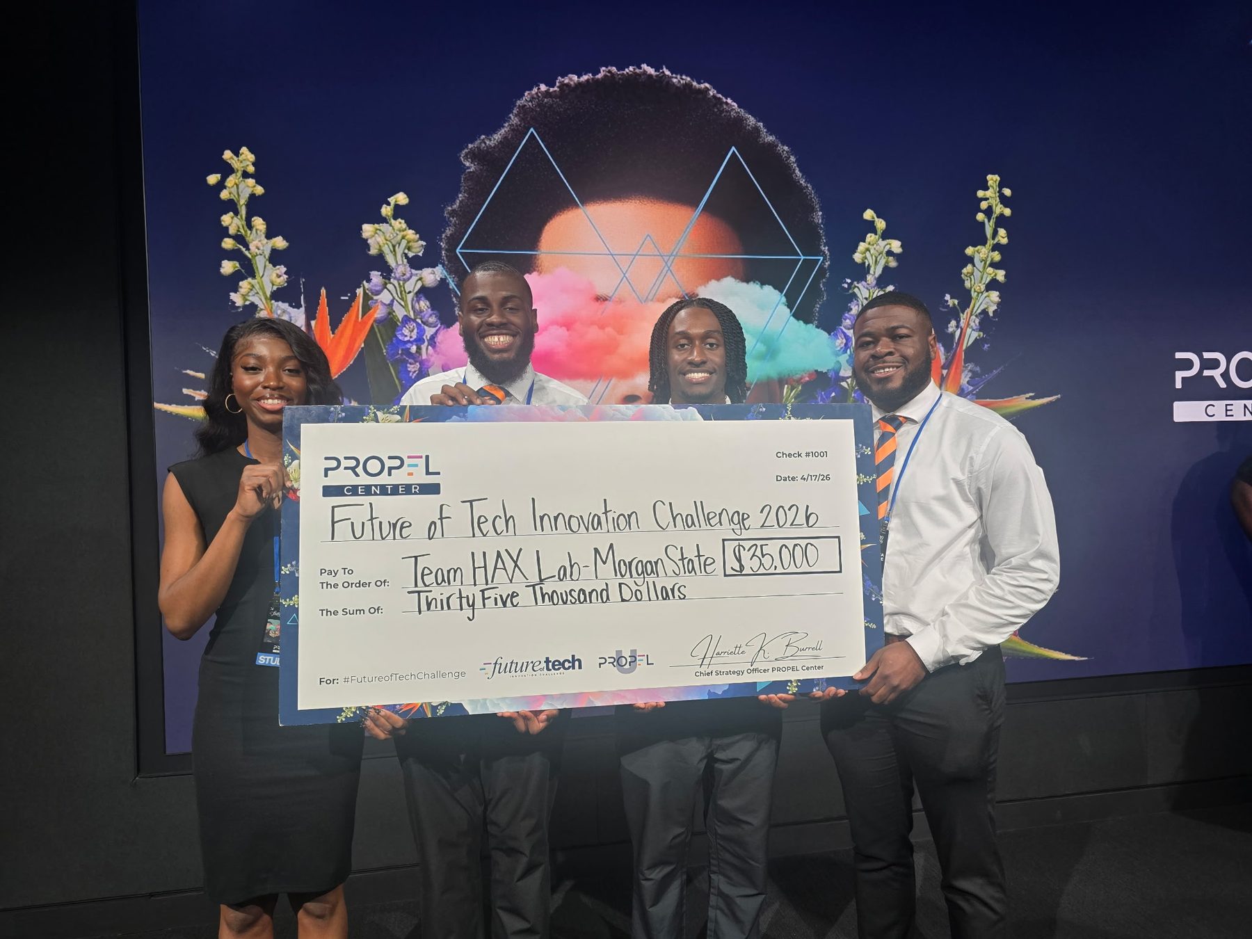 Team HAX Lab holding a $35,000 check from the PROPEL Center Future of Tech Innovation Challenge